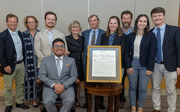 Dr. Carlos Ugas-Charcape and the Outcalt family