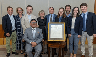 Dr. Carlos Ugas-Charcape and the Outcalt family