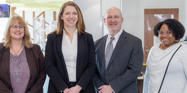 From left to right, Tracey Ferron, Paralegal, Legal Aid Society of Cleveland; Danielle Gadomski Littleton, Senior Attorney, Legal Aid Society of Cleveland; Kevin Margolis, Integration Partner, Benesch; and Charron Lewis, MD, Developmental-Behavioral Pediatrician, UH Rainbow Babies & Children’s, and Medical-Legal Champion.