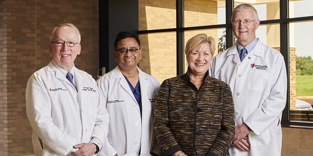 From left: A. Roger Tsai, MD, Anjan Gupta, MD, Lynn Heisler, John R. Gusz, MD